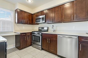 Kitchen with brown cabinets